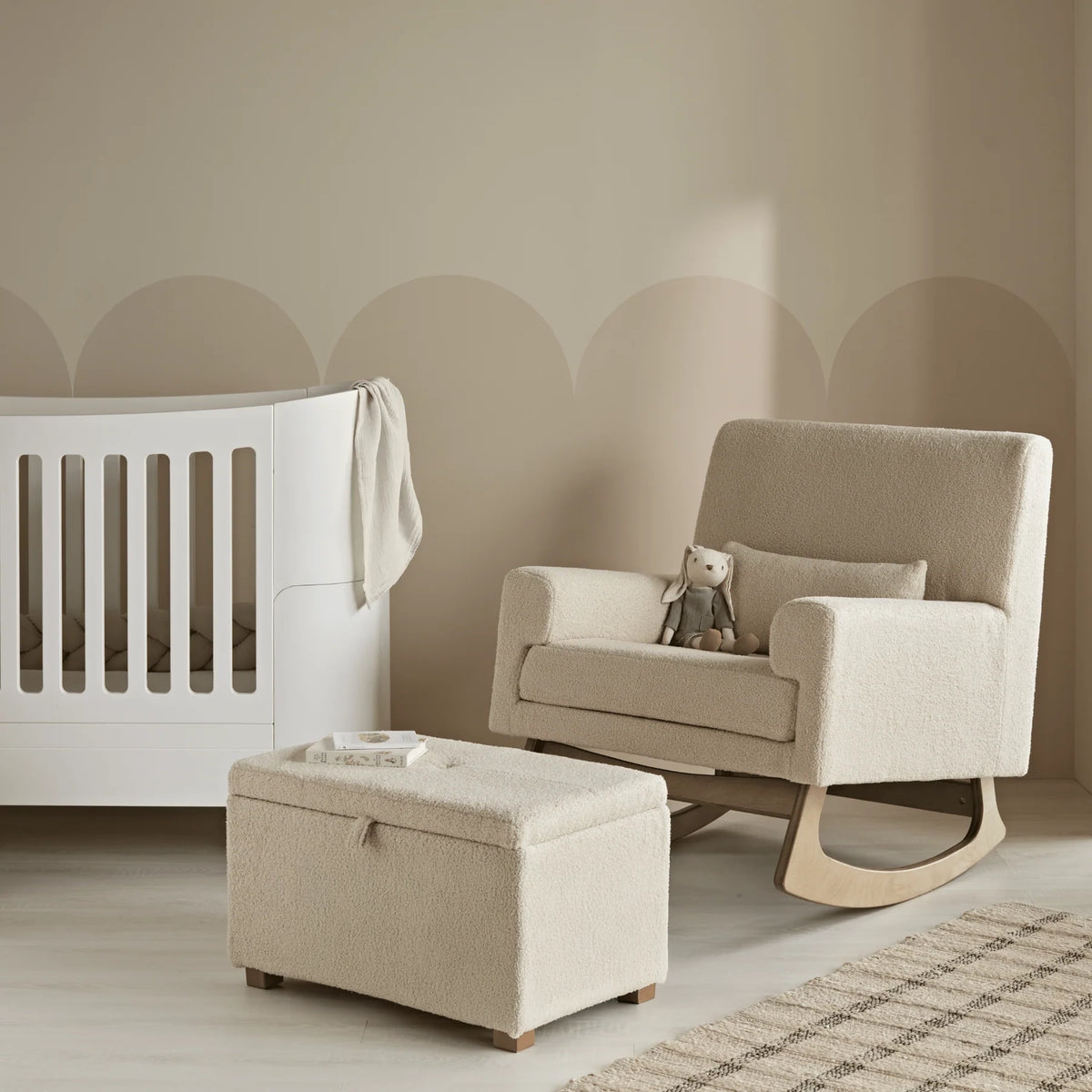 Gaia Baby Serena rocking chair in biscuit boucle fabric, showcasing a comfortable, modern nursing and rocking chair design.