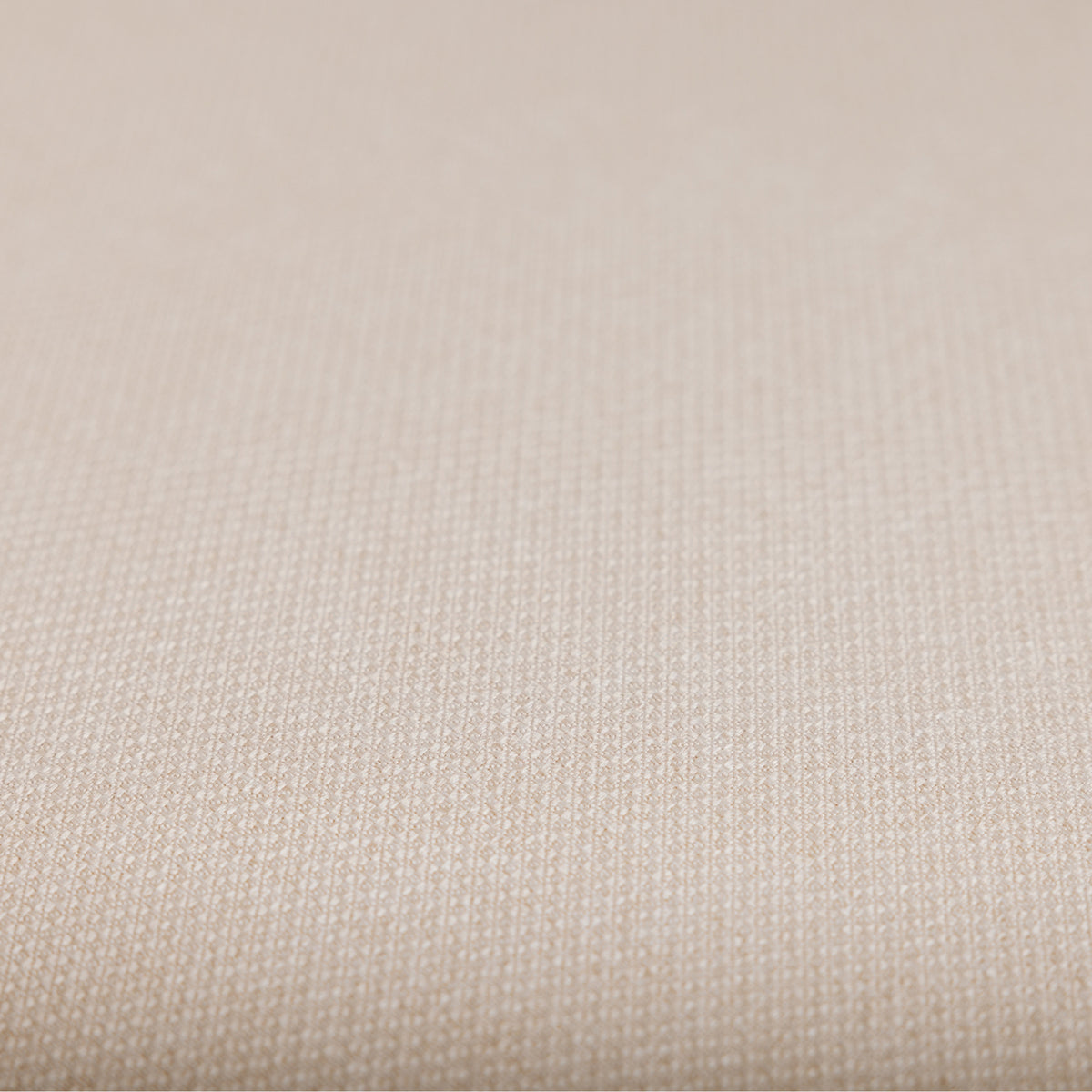 Close up of the soft, breathable Oat upholstery fabric on the Lyra nursing chair.