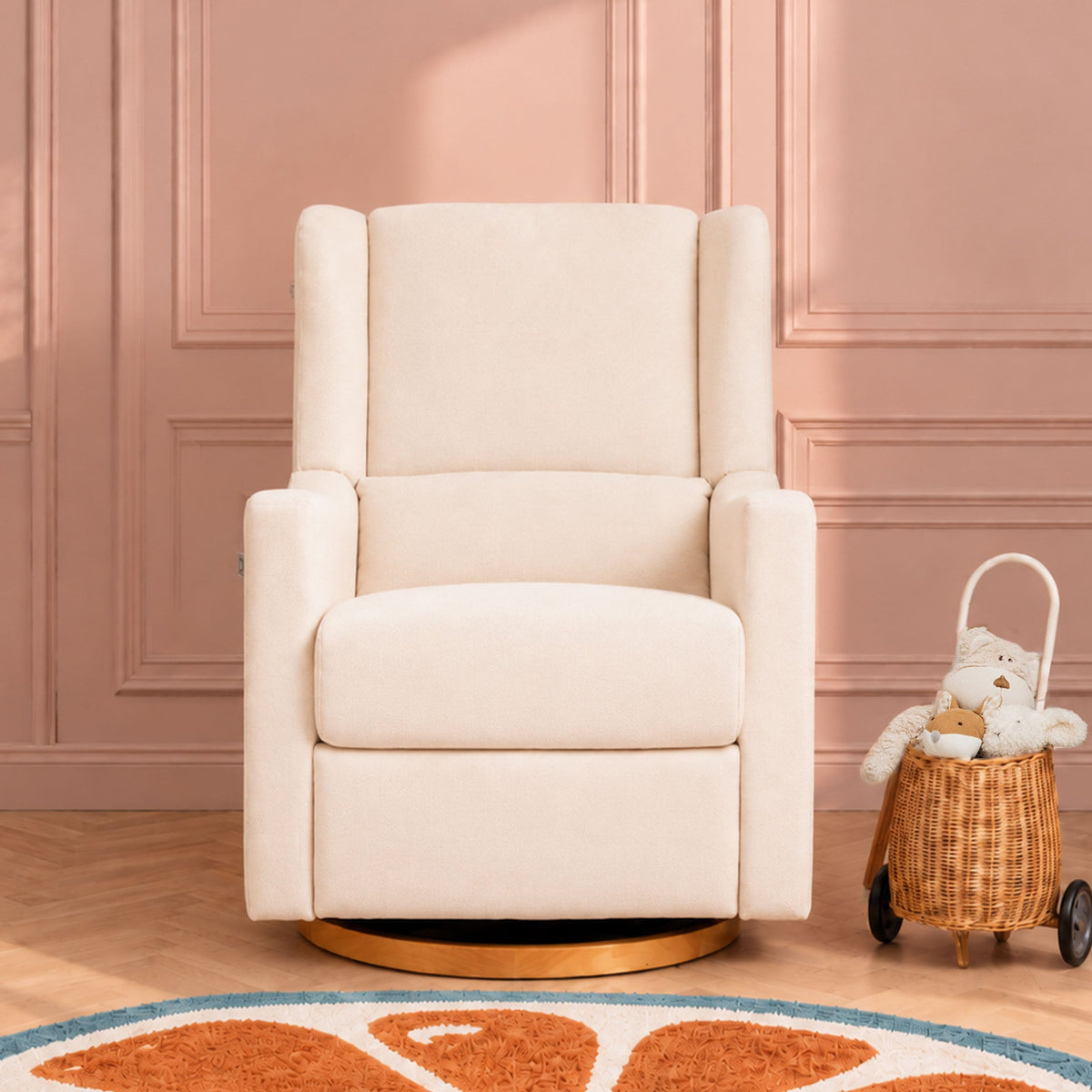 Gaia Baby Lyra nursing chair in Oat, front view in a blush nursery