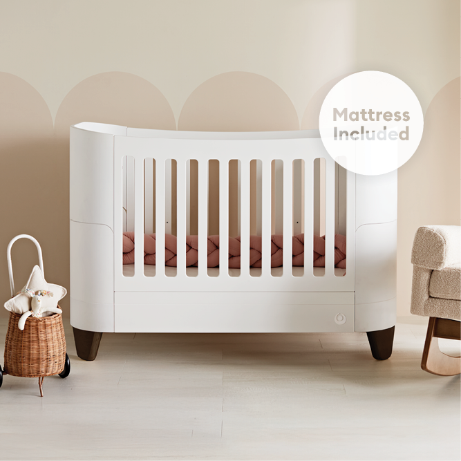 Gaia Baby Serena Convertible Cot Bed in white and walnut finish with included mattress, featuring a modern design for nursery use.