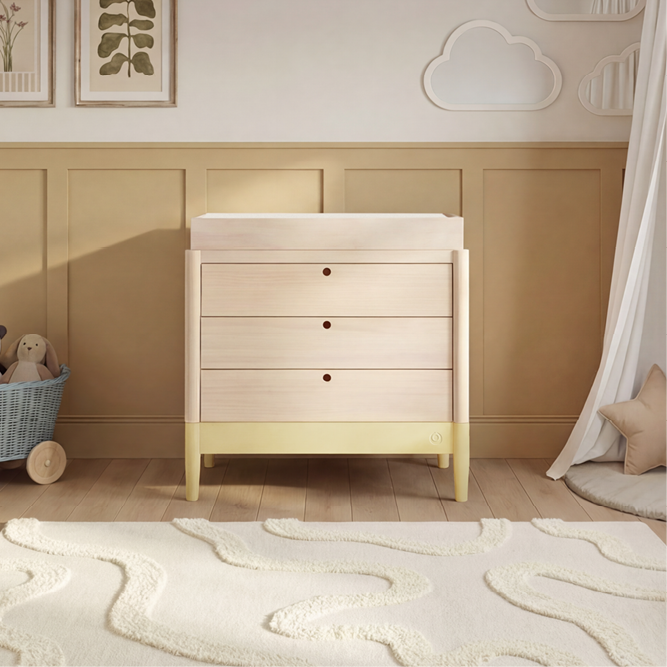 Gaia Baby Eos Dresser in natural wood finish with saffron yellow accents, featuring multiple drawers and modern design.