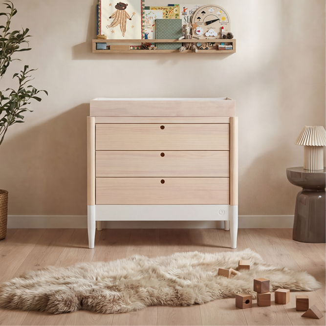 Natural white Gaia Baby Eos Dresser with multiple drawers, made of wood, ideal for nursery storage and organization.