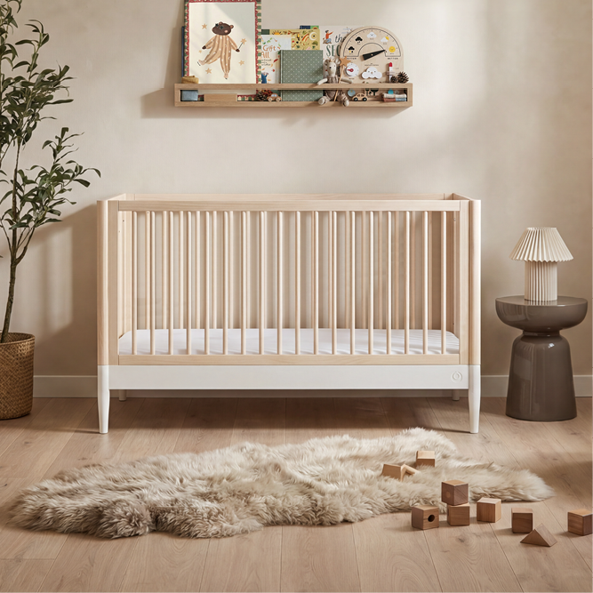 Gaia Baby Eos cot bed in natural and white wood finish, sturdy toddler bed with safety rails and slatted sides for gentle sleep.