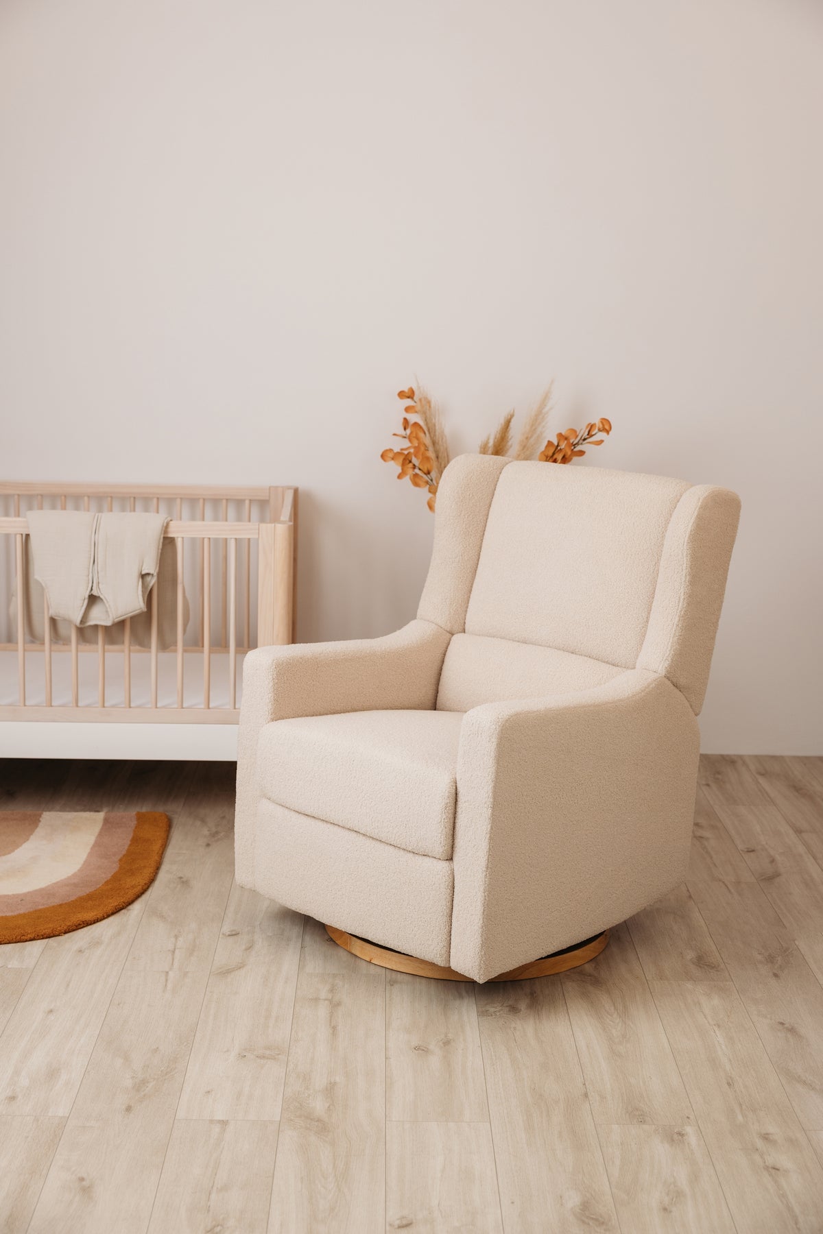 Gaia Baby Lyra Electric Recliner Nursing Chair in Biscuit Bouclé in a neutral nursery