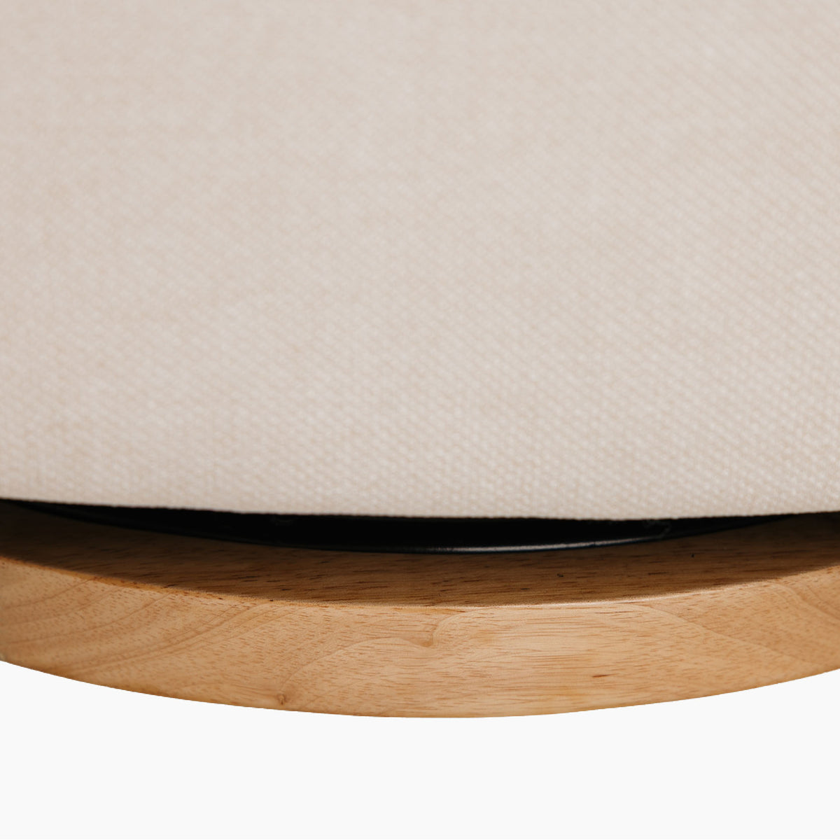 Close up of the Lyra nursing chair real wood swivel base.